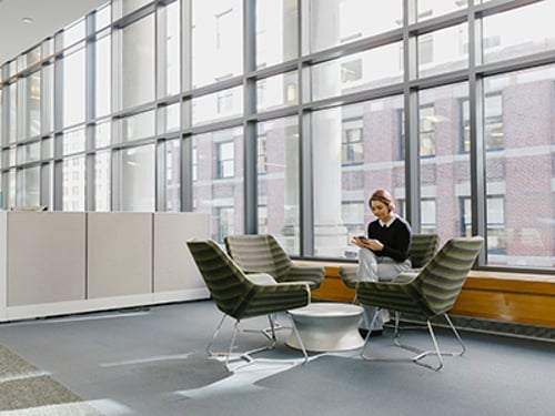 Person using a Slack integration on their smartphone and laptop