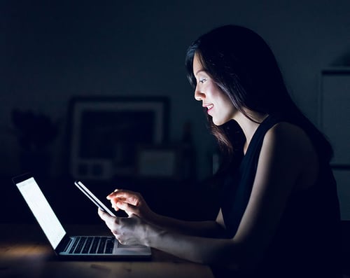 Woman on Phone and Laptop