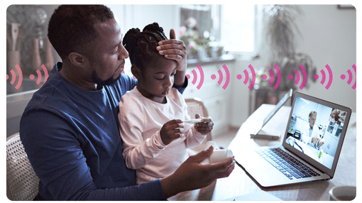 Image of man with daughter using telehealth